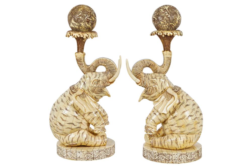 Appraisal: PAIR OF CHINESE BONE CARVED ELEPHANTS WITH SPHERESwith removable spheres