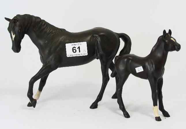 Appraisal: Beswick Black Beauty horse and Royal Doulton black Foal