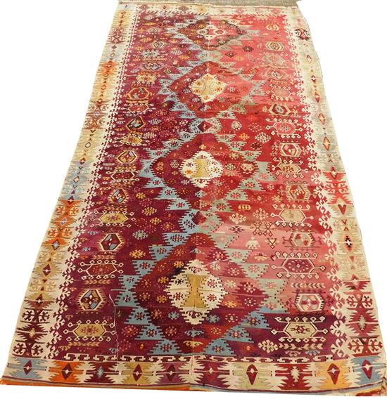 Appraisal: RUG Semi-Antique Turkish Kilim carpet red ground with tan cobalt