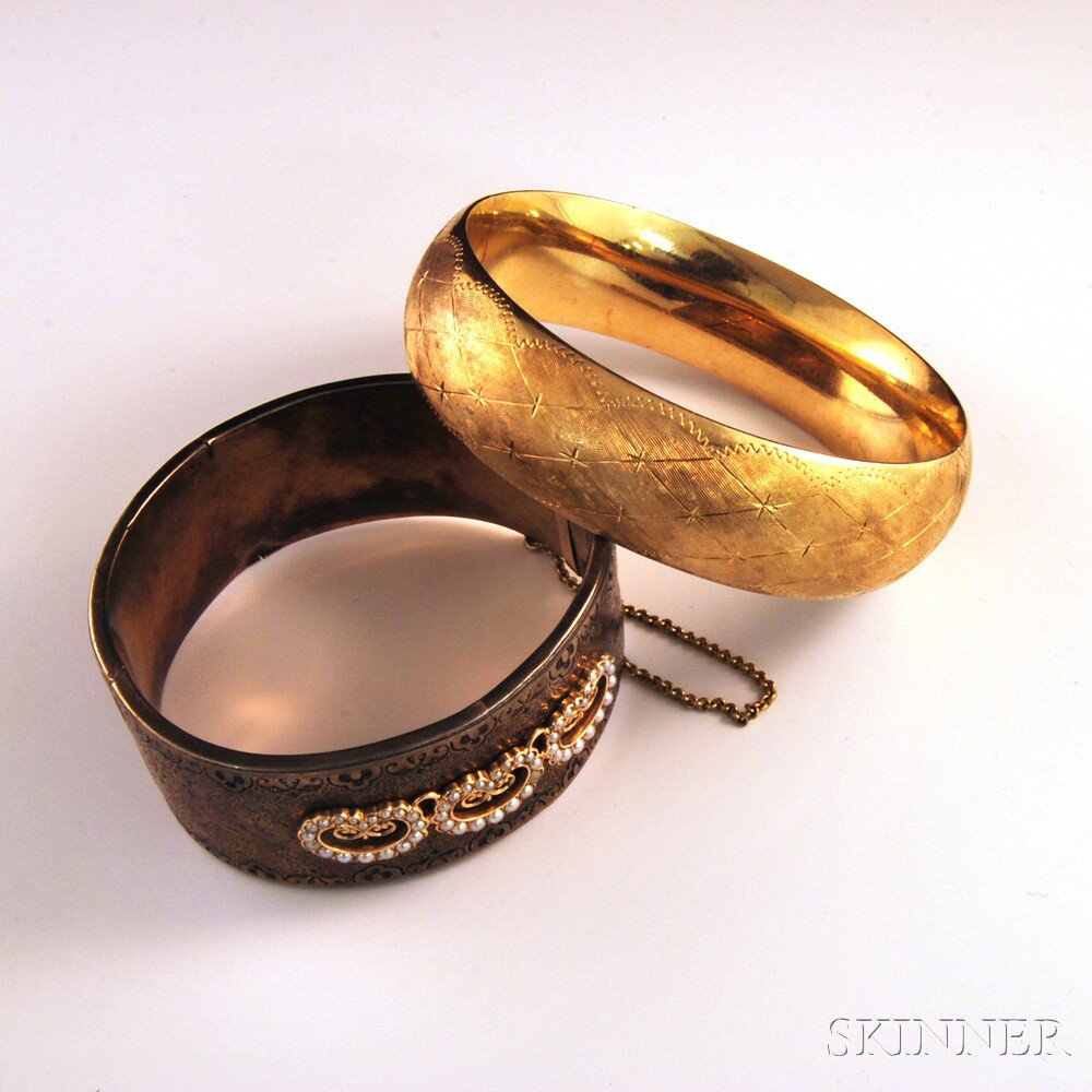 Appraisal: Two Hinged Bangle Bracelets a kt gold Florentine bangle with