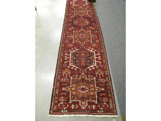 Appraisal: Heriz Persian Handmade Runner central geometric medallions on red field