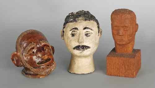 Appraisal: Two earthenware heads together with a carved bust of a