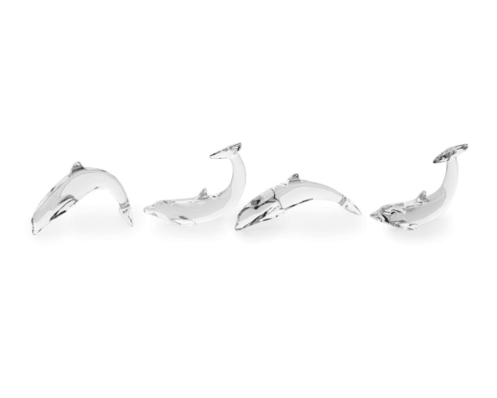 Appraisal: Four Baccarat clear glass dolphins Second-half th Century Each signed