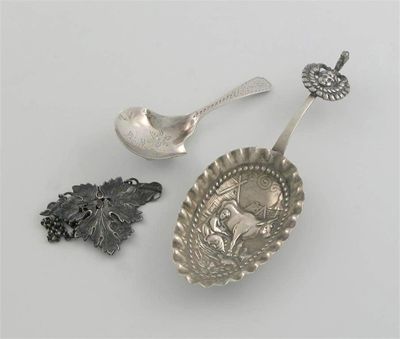 Appraisal: A George III caddy spoon with shovel bowl engraved decoration