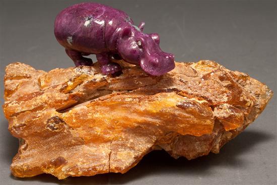 Appraisal: Continental carved hardstone hippopotamus with jeweled eyes and fossilized amber