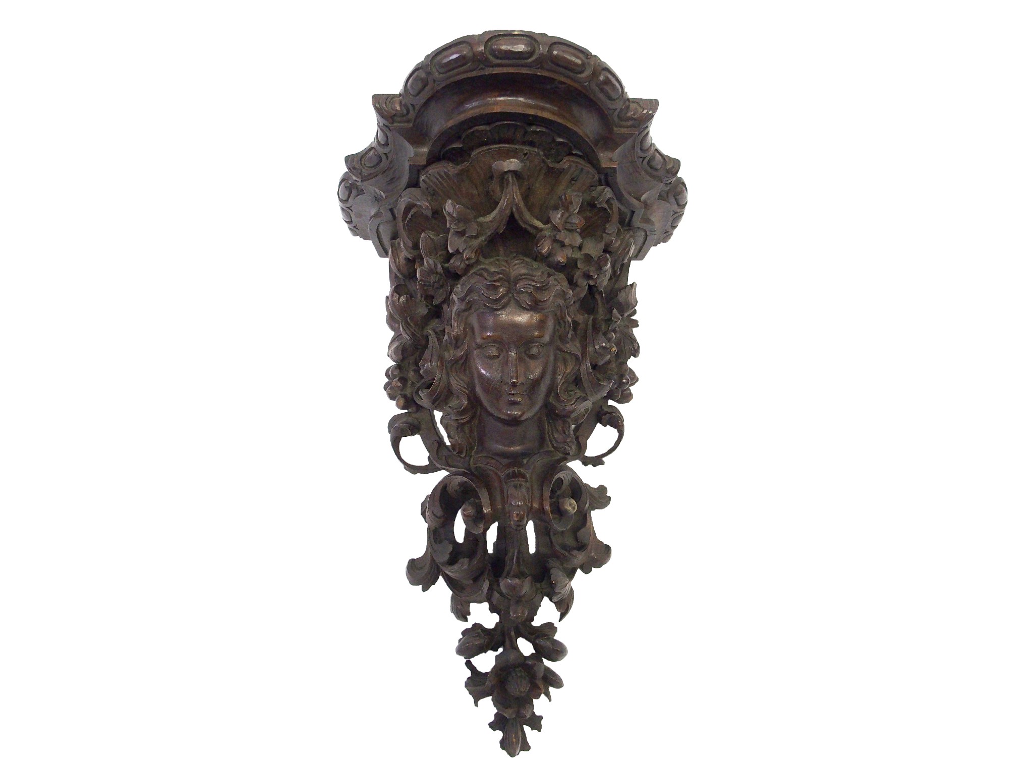 Appraisal: A Victorian stained walnut bracketcarved with a female head amongst