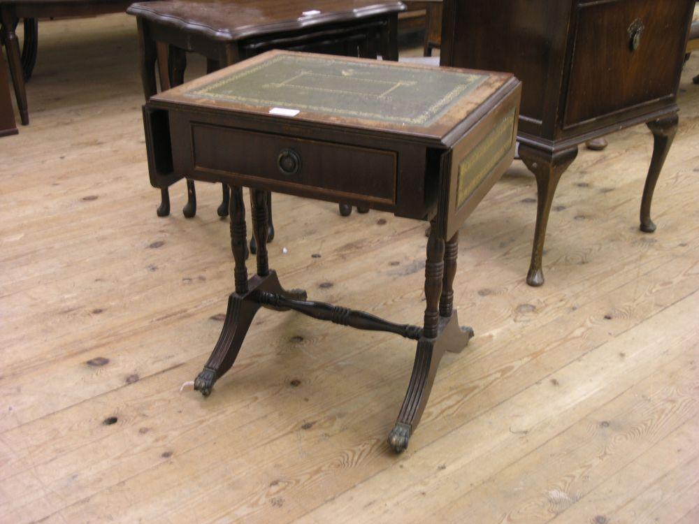 Appraisal: A mahogany coffee table sofa table type with drop leaves