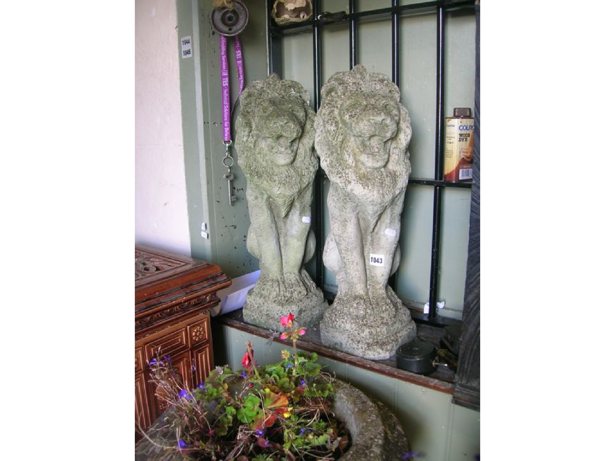 Appraisal: A pair of weathered cast composition stone garden ornaments in