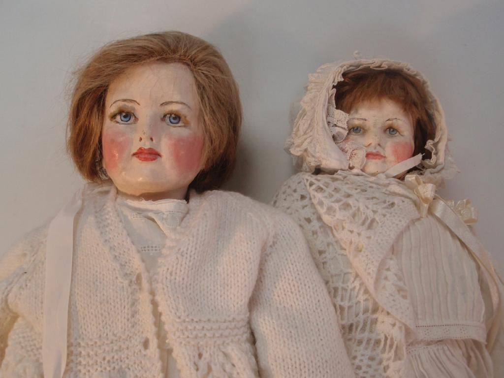 Appraisal: A kid bodied doll with a painted face inserted eyelashes