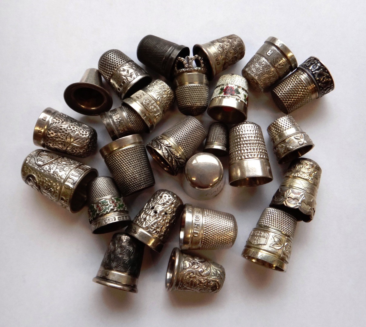 Appraisal: Twenty five assorted hallmarked silver thimbles and a thimble stand