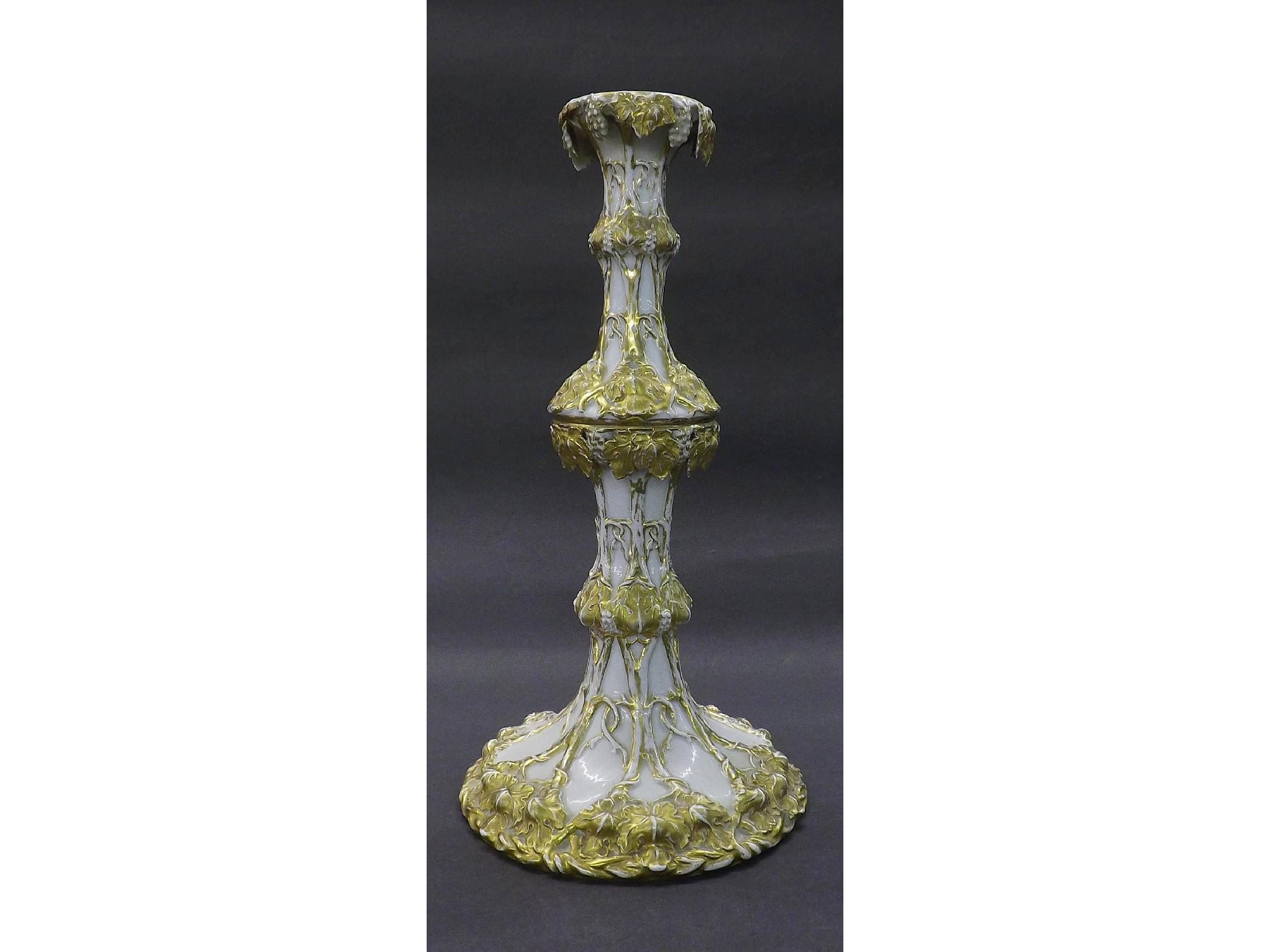 Appraisal: Dresden porcelain candlestick decorated with various gilded vines upon a