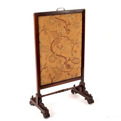 Appraisal: A mid th Century rosewood fire screen with adjustable needlework