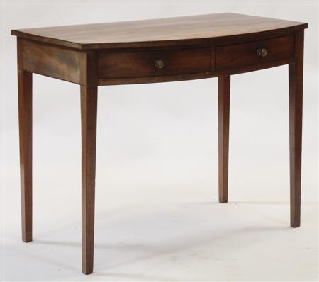 Appraisal: A George III mahogany bowfront side table with two frieze