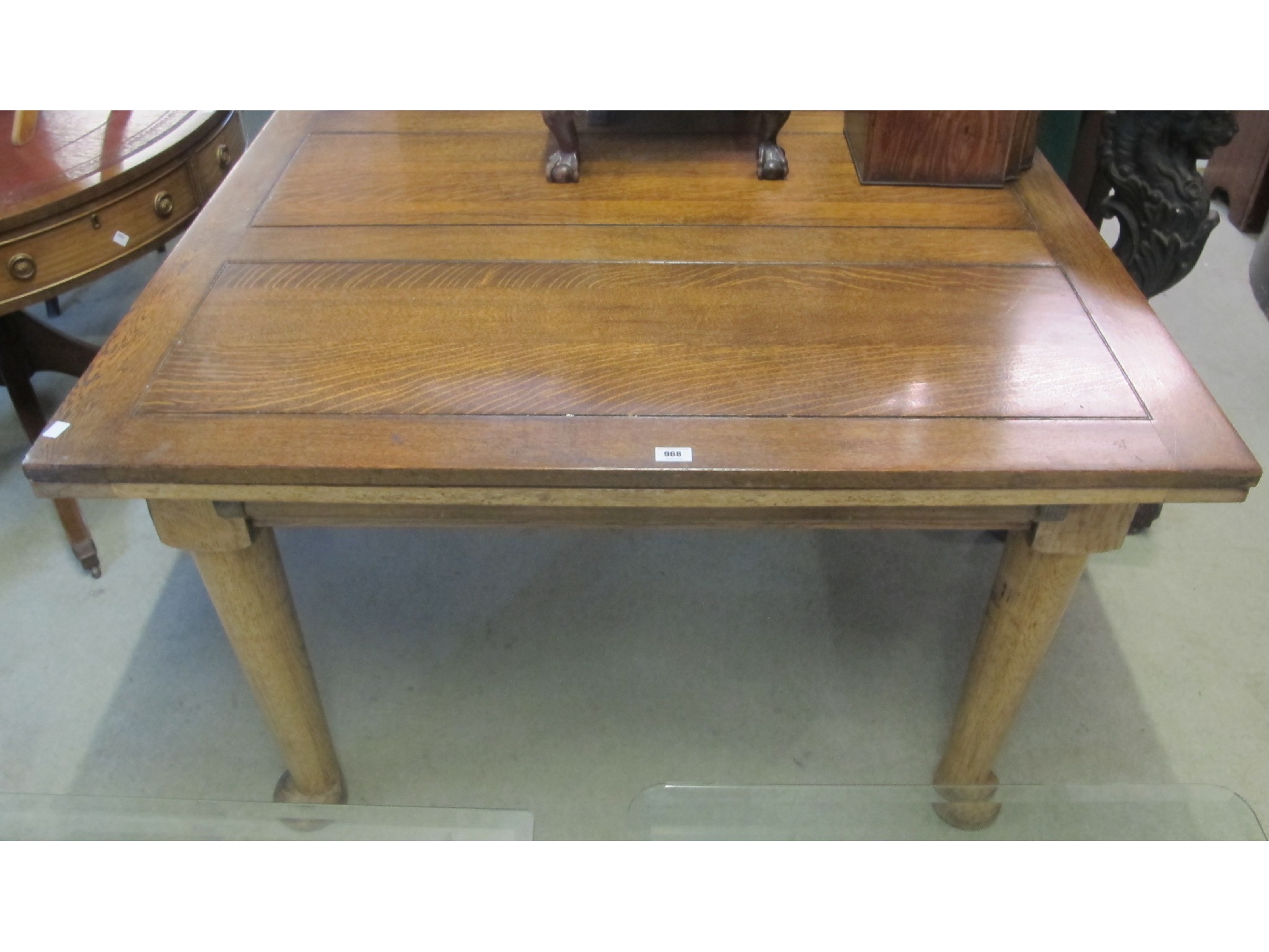 Appraisal: A large oak pull-out dining table