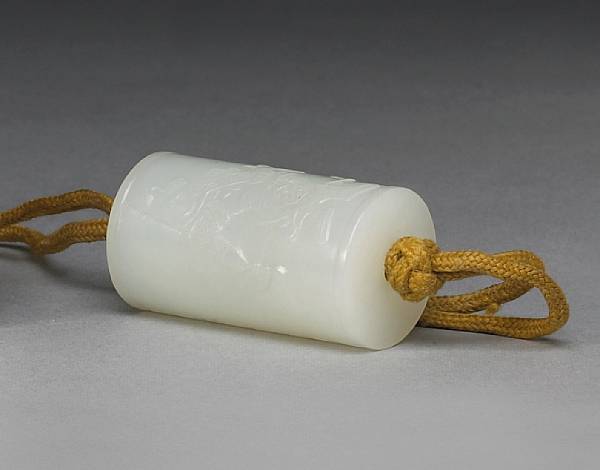 Appraisal: A fine white jade 'lezi' cylinder Of simple cylindrical shape