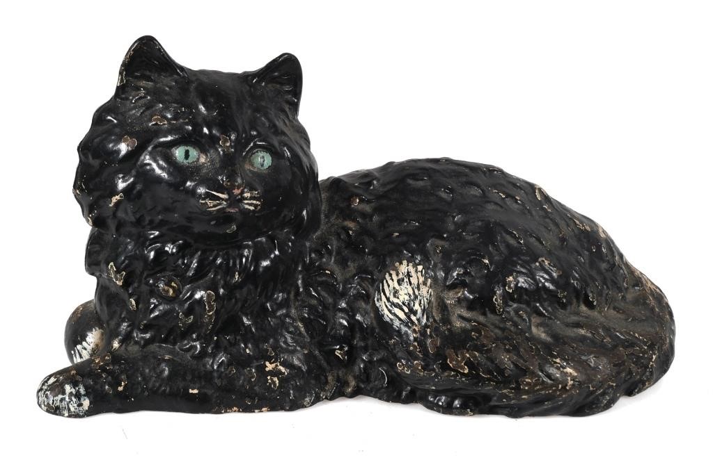 Appraisal: Antique cast iron black cat with tail paws and whiskers