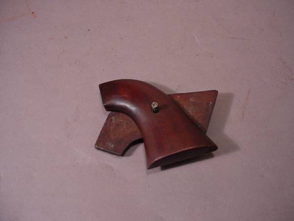 Appraisal: A pair of walnut grips for the Colt single action