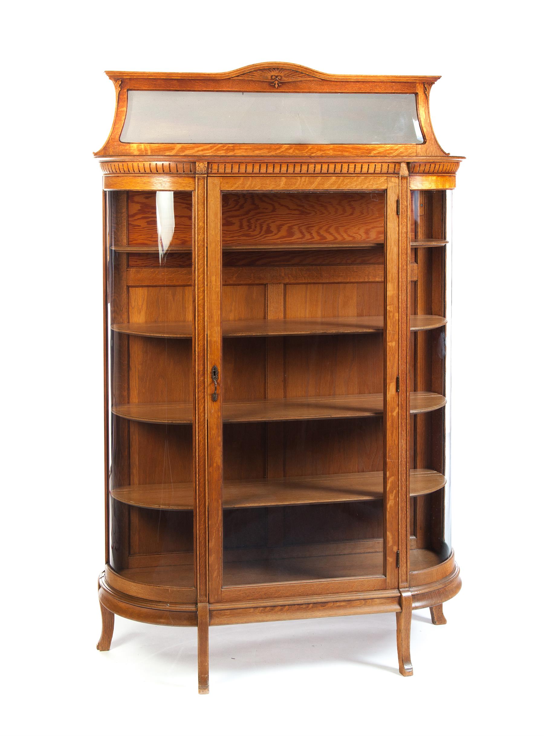 Appraisal: CURVED GLASS OAK CHINA CABINET American st quarter- th century