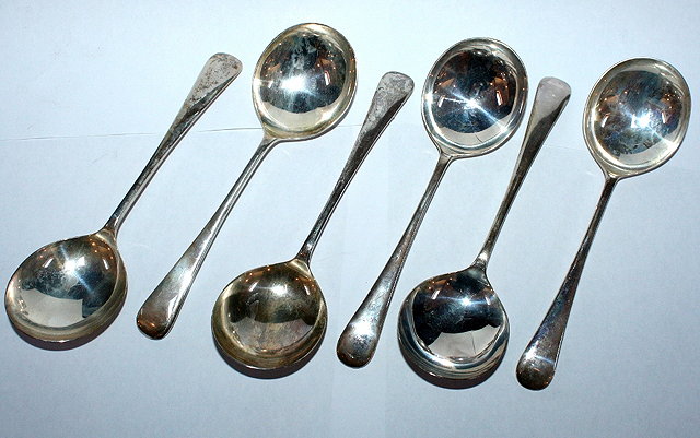 Appraisal: A SET OF FOUR SILVER OLD ENGLISH PATTERN SOUP SPOONS