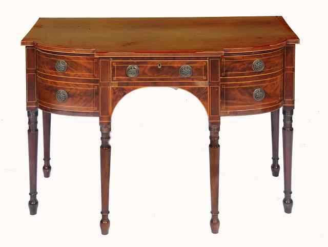 Appraisal: A LATE GEORGE III MAHOGANY SMALL SIDEBOARD of bowed and