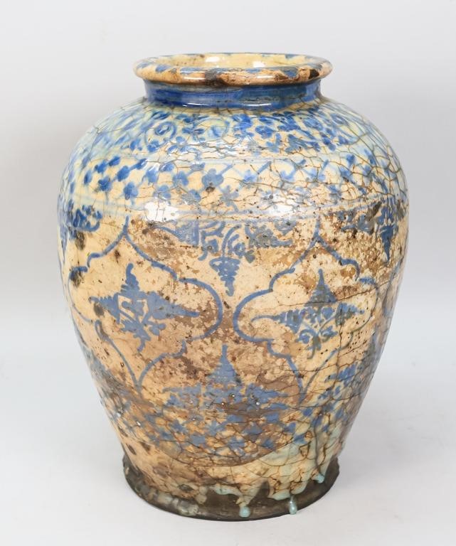 Appraisal: Persian glazed ceramic vase Blue and white tin glaze With