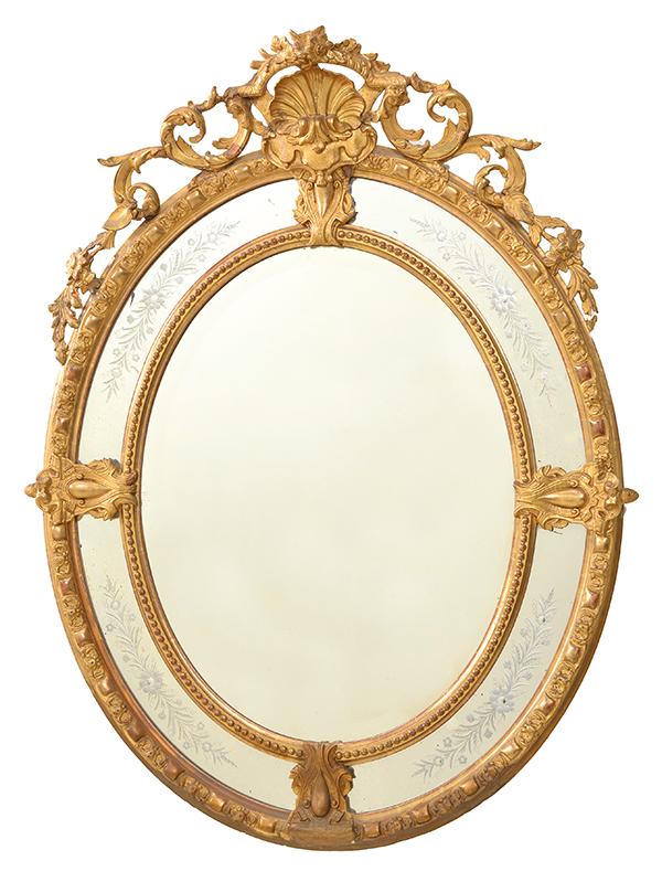 Appraisal: AN OVAL FRENCH GILTWOOD WALL MIRROR WITH AN ETCHED AND