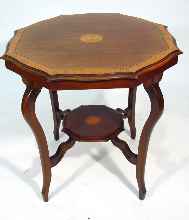 Appraisal: Edwardian crossbanded and inlaid octagonal mahogany occasional table supported by