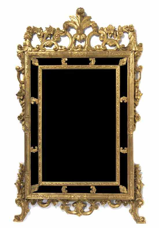 Appraisal: An Italian Giltwood Pier Mirror having a plume crest over