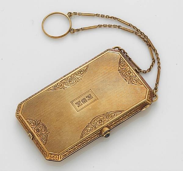 Appraisal: An eighteen karat gold compact opening to reveal a mirror