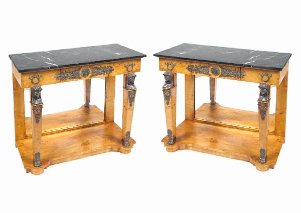 Appraisal: A pair of Empire style consoles with marble tops height