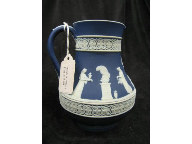 Appraisal: Wedgwood Dark Blue Jasperware Milk Pitcher classical scenes of maidens