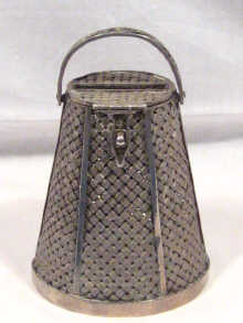 Appraisal: A Russian silver woven latticework money box hallmarked St Petersburg