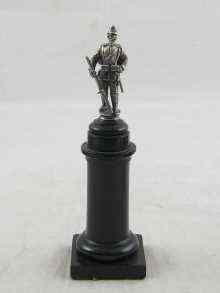 Appraisal: A finely modelled Prussian soldier in white metal tests silver