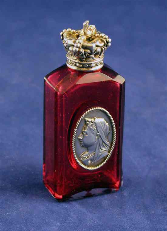 Appraisal: A Victorian silver mounted ruby glass scent bottle with inset