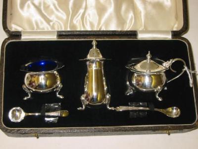 Appraisal: A CONDIMENT SET maker J R Birmingham of bellied circular