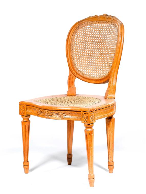 Appraisal: CHAIR Louis XVI France Carved moulded and fluted walnut Caned