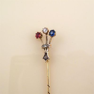 Appraisal: A gem set fleur de lys gold stick pin set