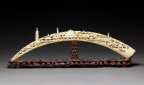 Appraisal: A large reticulated ivory landscape tusk th Century Deeply undercut