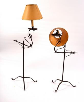 Appraisal: Two wrought iron single light lamps on tripod bases cm