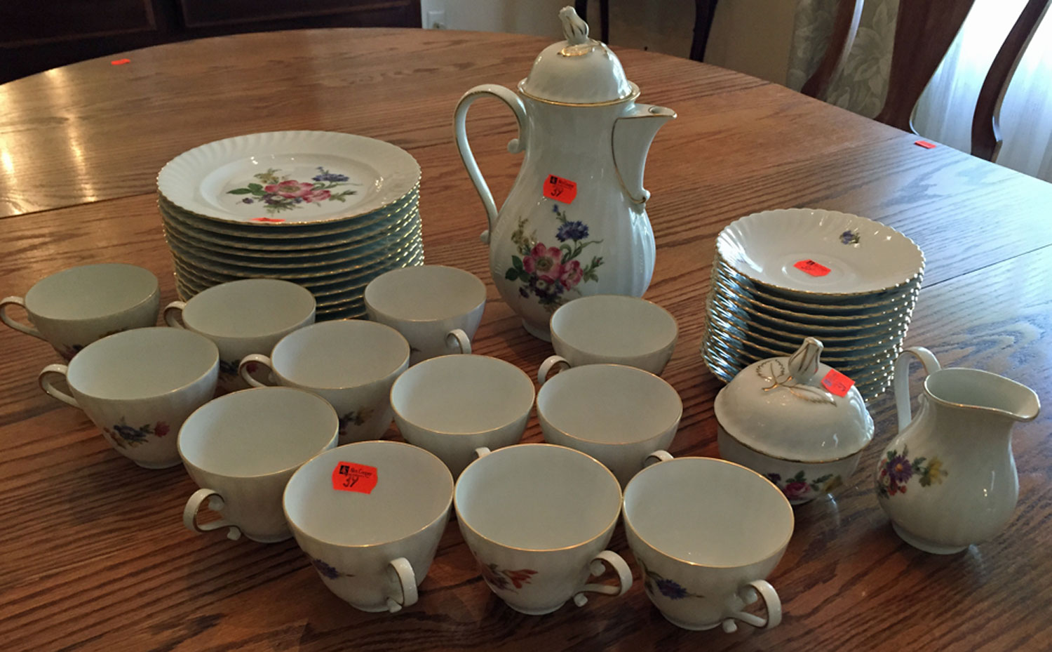 Appraisal: Kaiser china tea and dessert set for floral decorated