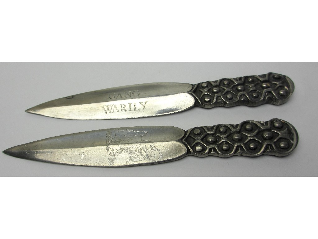 Appraisal: A pair of Scottish pewter daggers with Celtic patterned handles