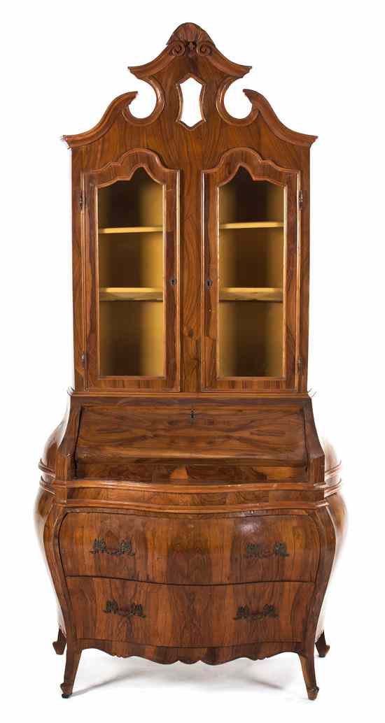 Appraisal: A Continental Burlwood Secretary Bookcase having a pierce carved crest