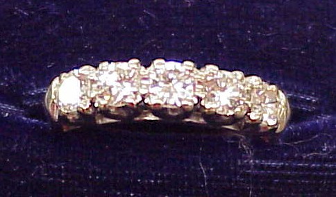 Appraisal: JEWELRY One K white gold stone lady's diamond wedding band