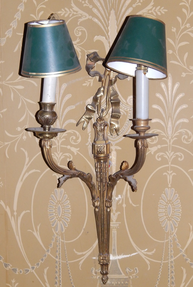 Appraisal: A pair of gilt metal two branch wall lights in