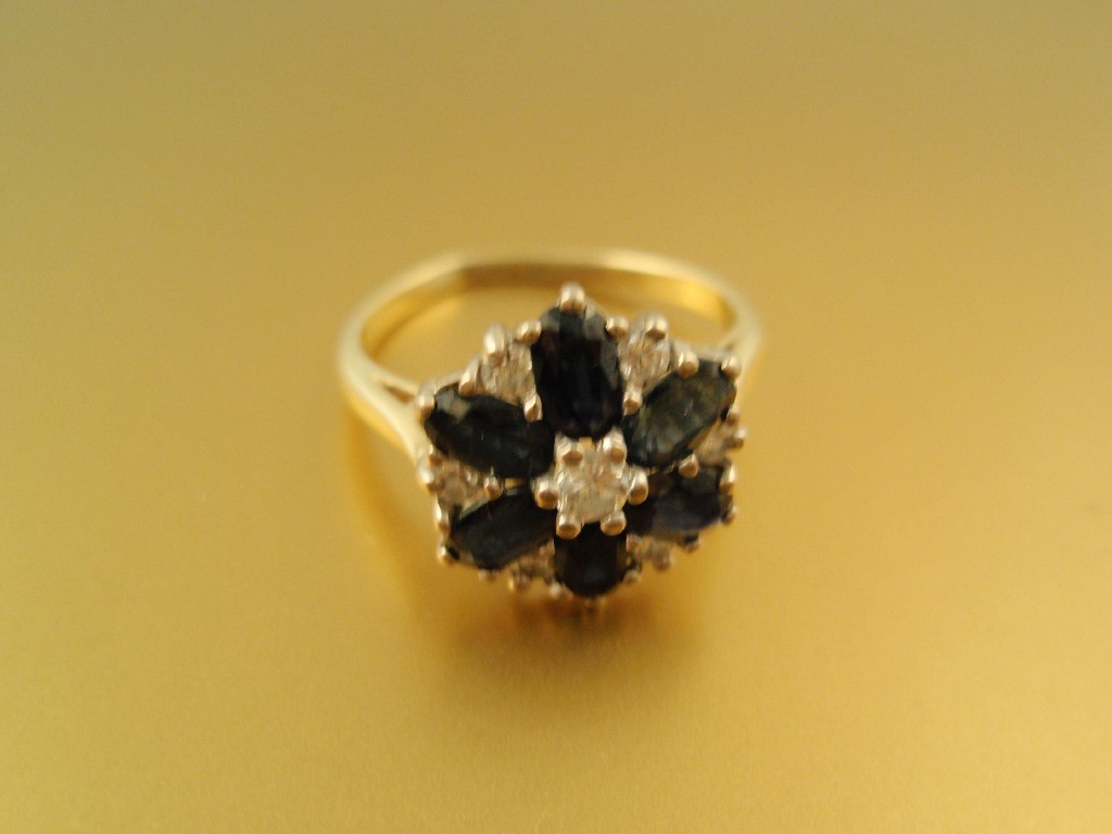 Appraisal: A diamond and sapphire cluster dress ring to yellow metal