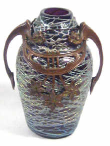 Appraisal: An Art Nouveau amethyst glass vase with trailed decoration and