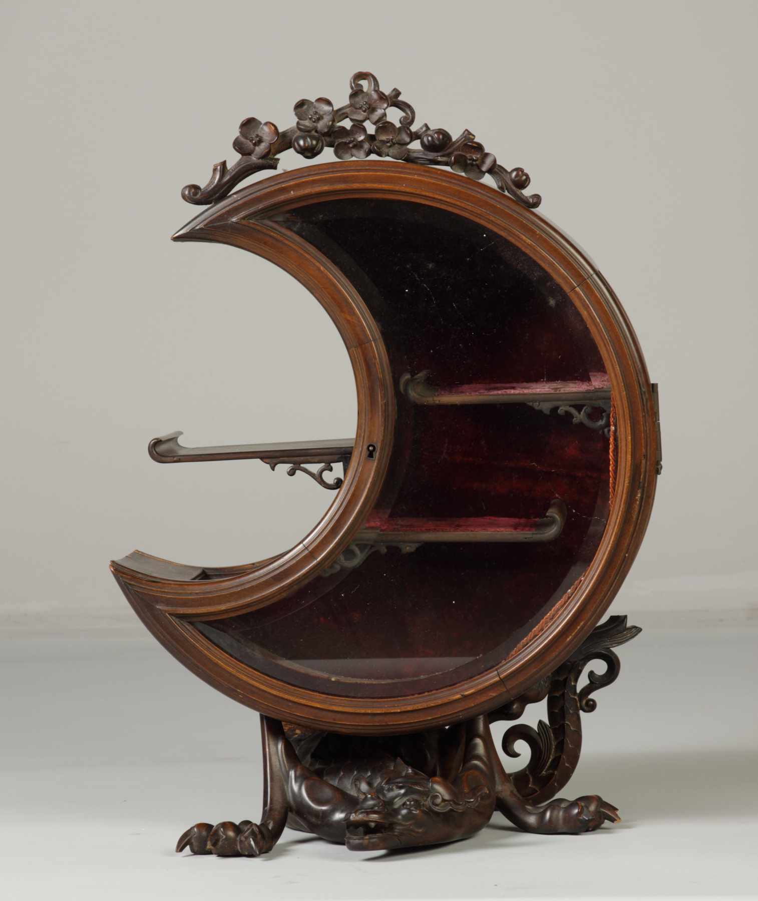 Appraisal: Unusual Crescent Shaped Carved Wood Display Cabinet Dragon base Condition