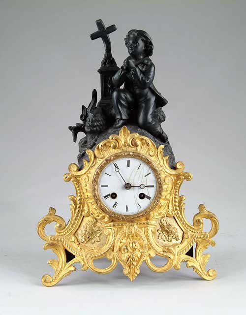 Appraisal: FIGURAL MANTLE CLOCK The brass front decorated with scrolls and