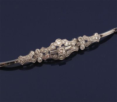 Appraisal: A diamond bracelet The graduated circular and baguette shaped diamonds