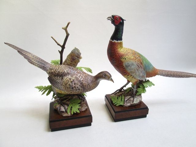 Appraisal: TWO ROYAL WORCESTER BONE CHINA FIGURINES male and female Ring-Necked